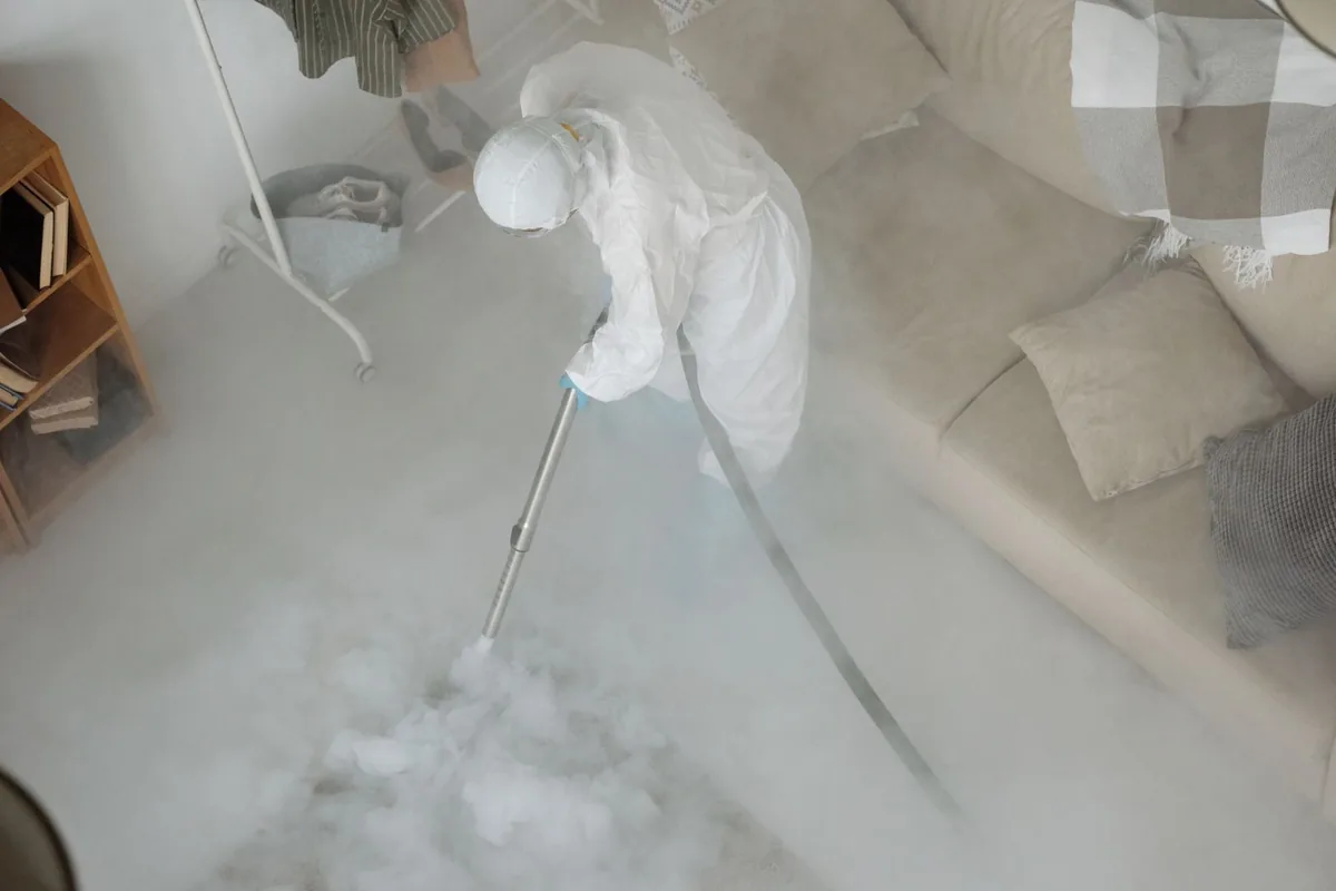 Biohazard cleanup technician in protective equipment, Monarch Mill, SC